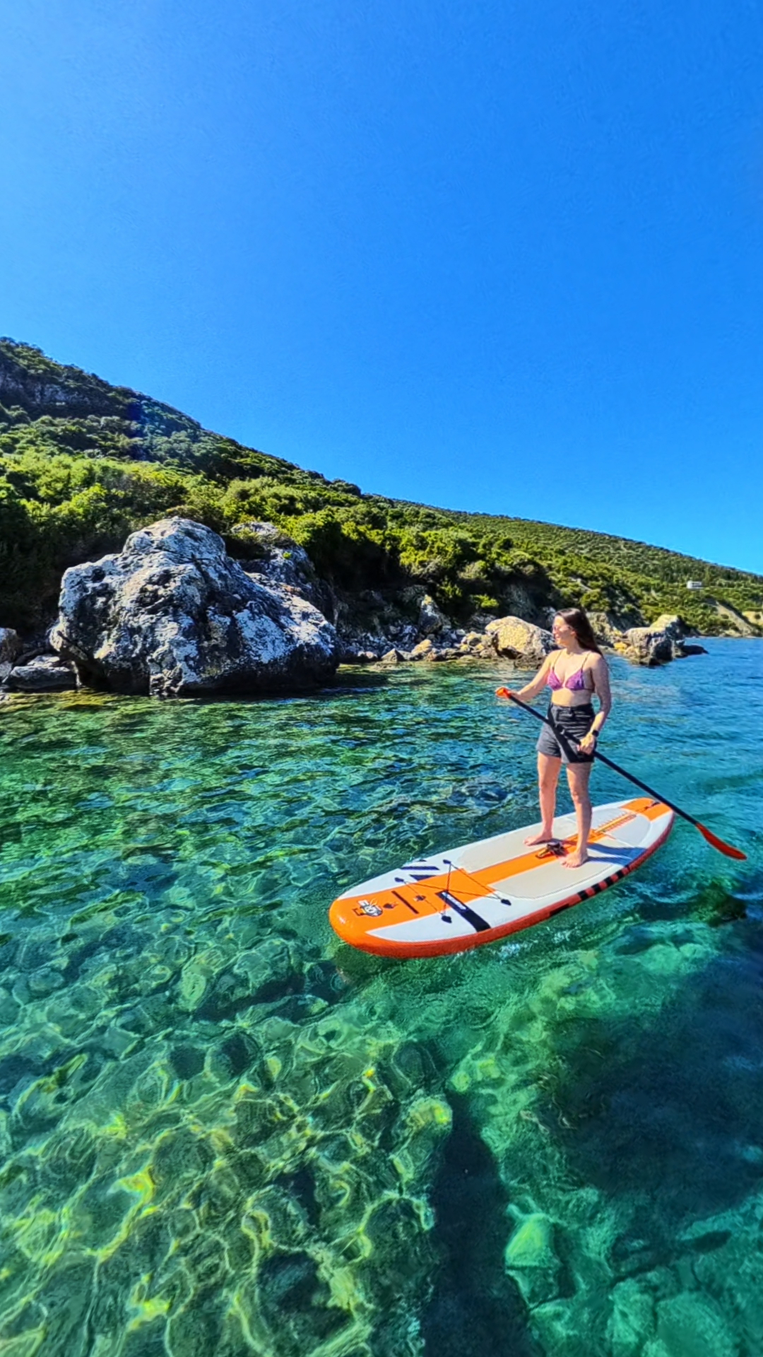 SUP session in a clear turquoise Ionian bay